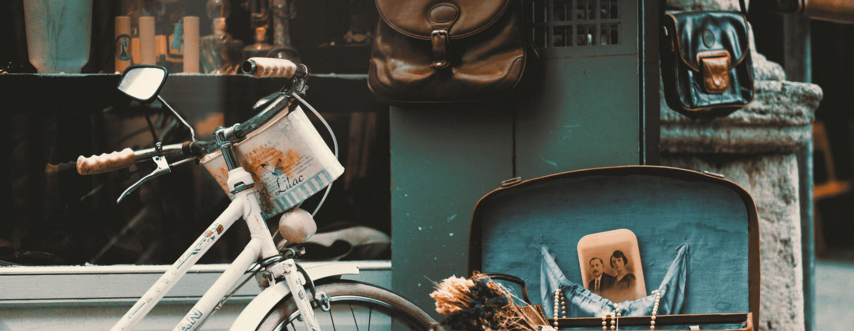 Vintage bicycle, suitcase, and other items